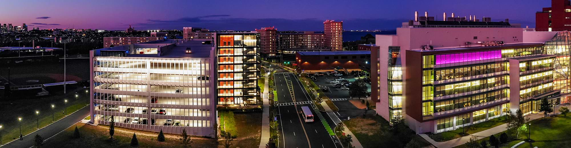 An aerial view of the UMass Boston campus at night