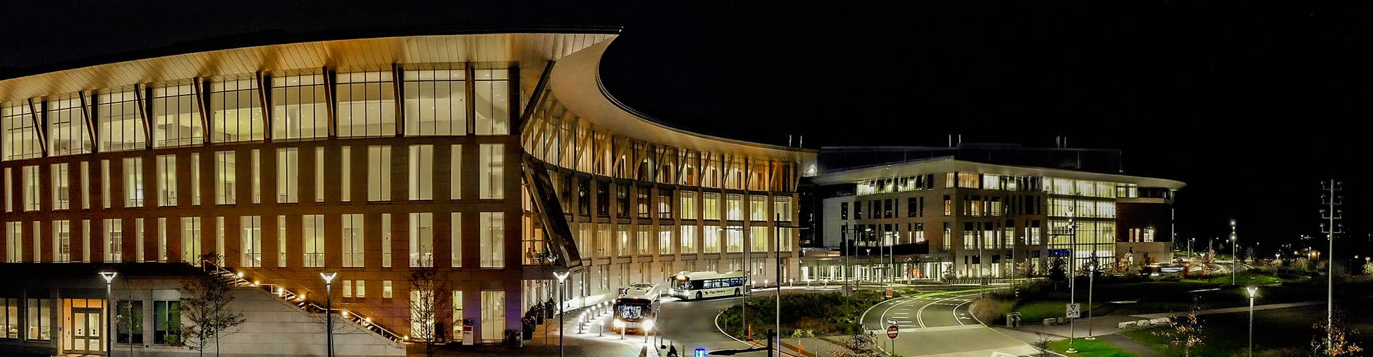 An aerial view of the UMass Boston campus at night