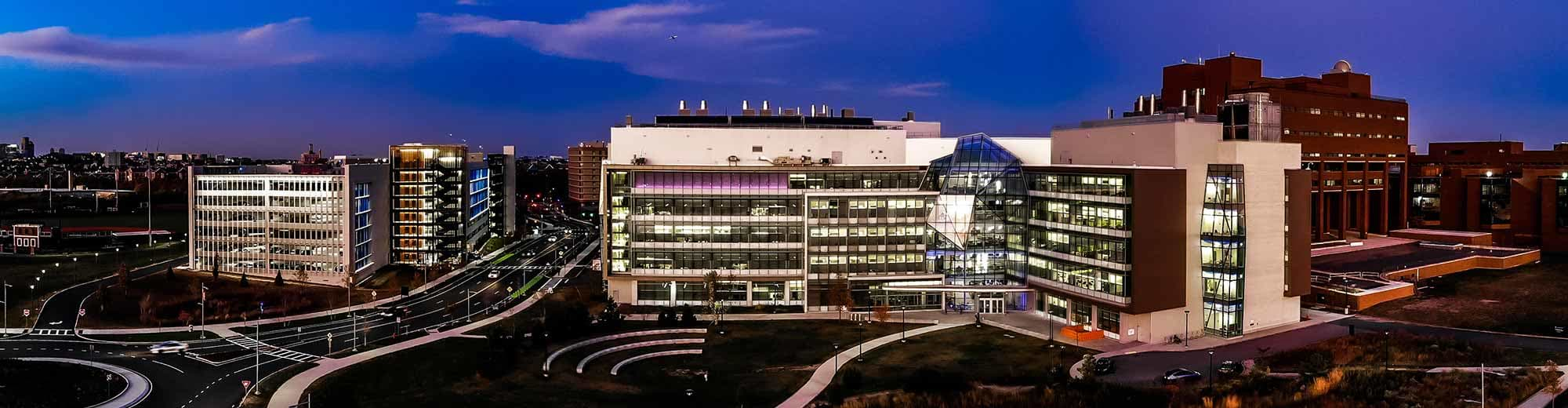 An aerial view of the UMass Boston campus at night