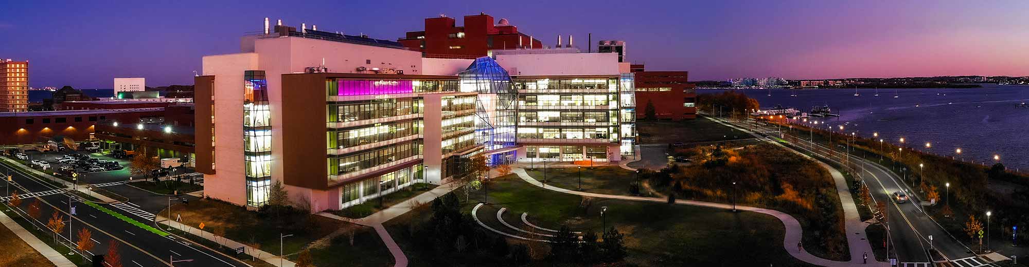 An aerial view of the UMass Boston campus at night